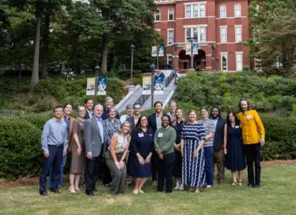 Group of professionals and students outside Georgia Tech building.