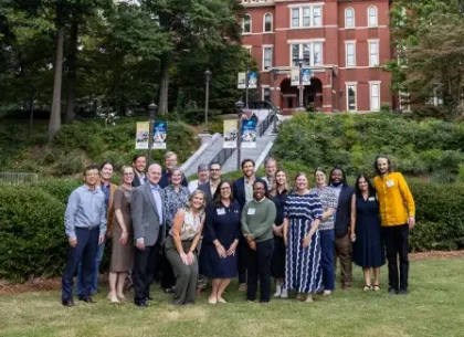 Group of professionals and students outside Georgia Tech building.